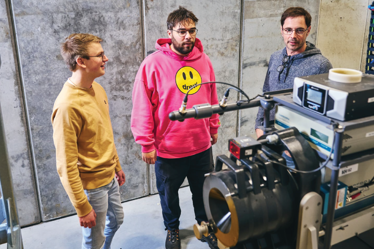 3 colleagues behind dector of E.L.M.O. installation