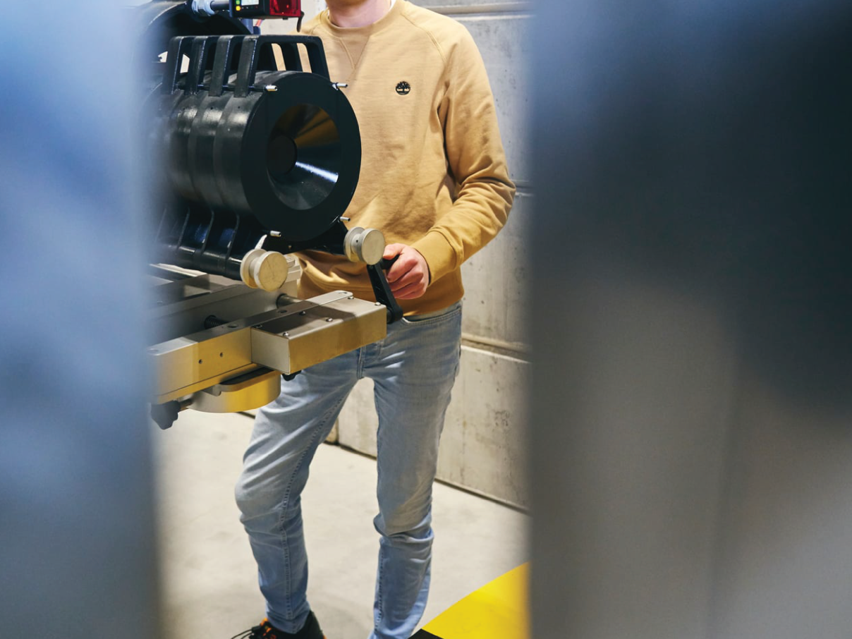 Colleague next to detector